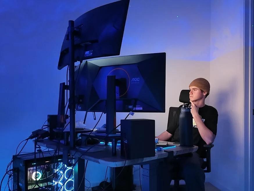 London Leffler working at a multi-monitor desk setup in 2026